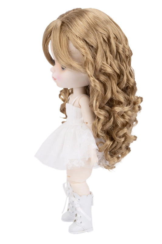 Doll with long blonde hair wearing a white dress and boots on a white background