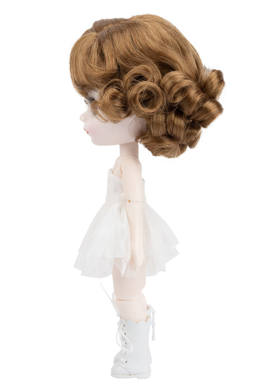 Doll with a styled wig and white outfit on a white background