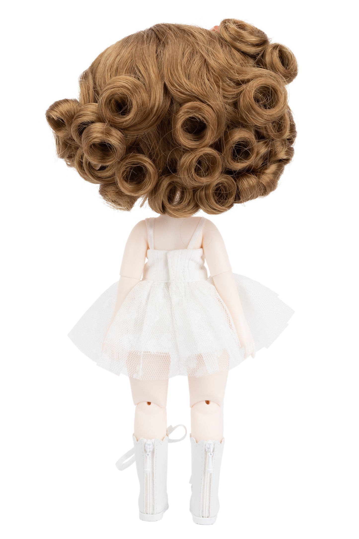 Doll with a large auburn curly wig on a white background