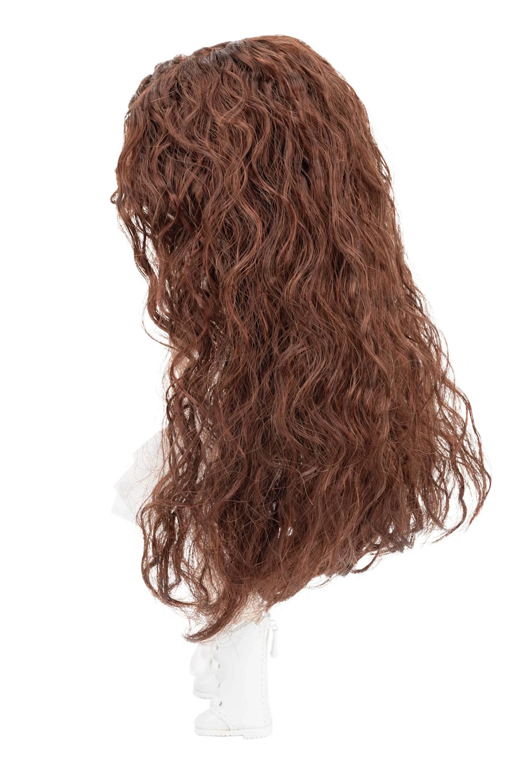 Brown wig on a mannequin head against a white background