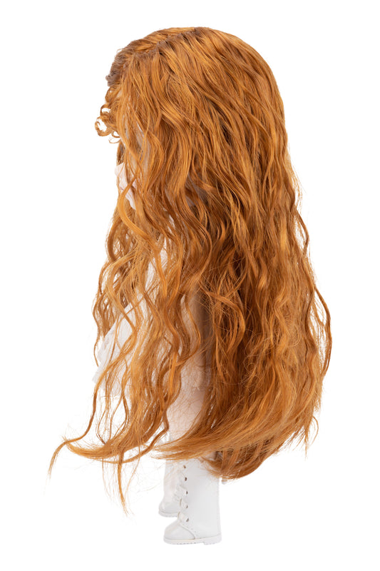 Doll head with long orange wig on a white background
