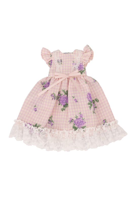 Pink checkered dress with floral patterns on a white background