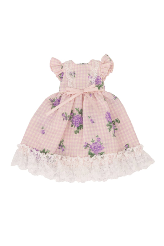 Pink checkered dress with floral patterns on a white background