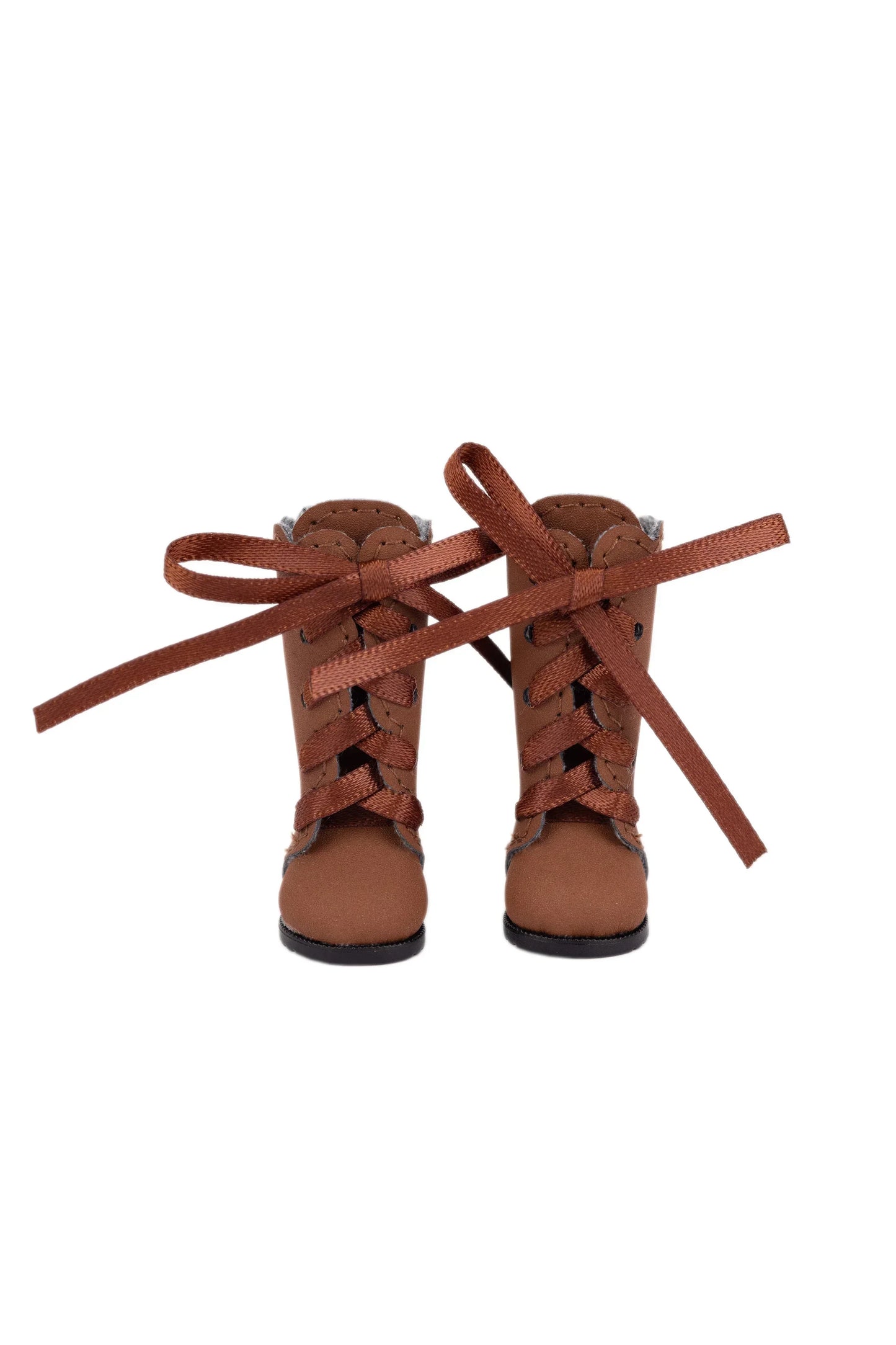Pair of brown lace-up boots with laces on a white background