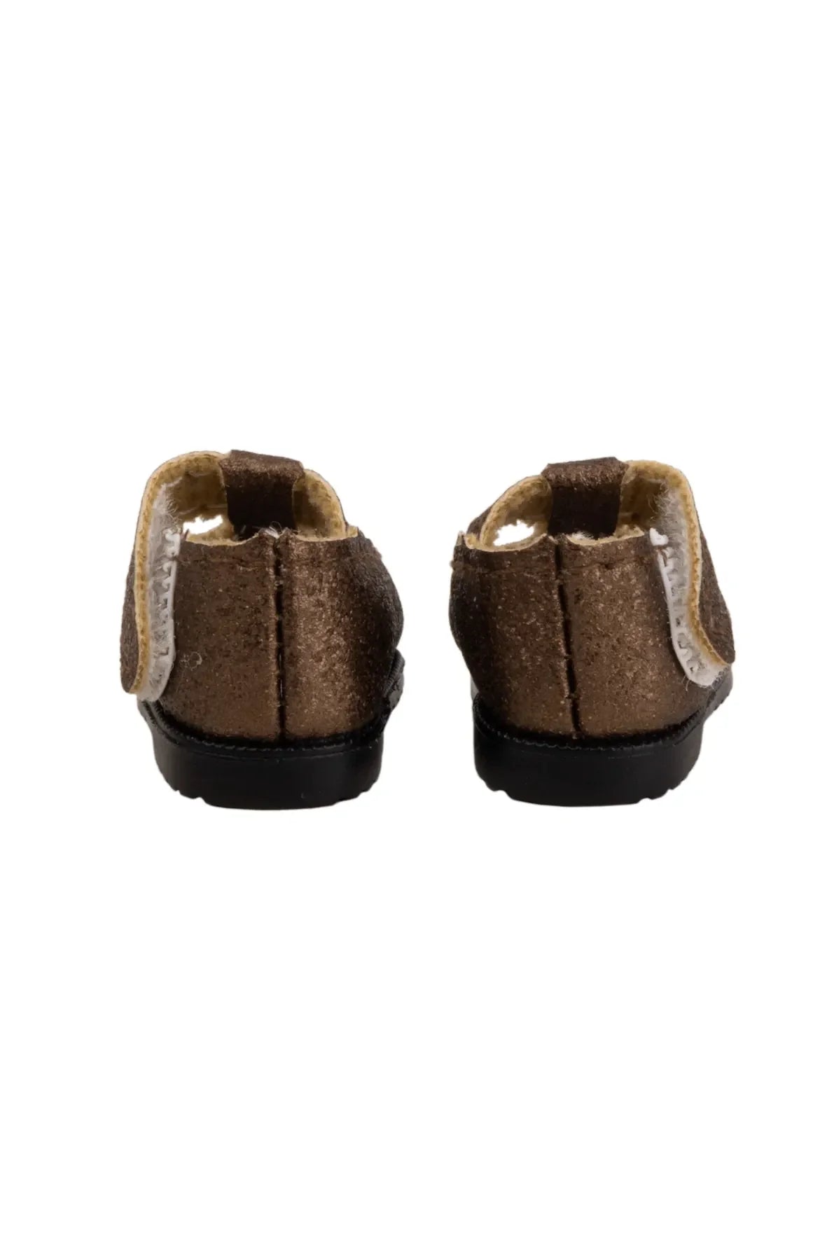 Pair of brown doll shoes on a white background