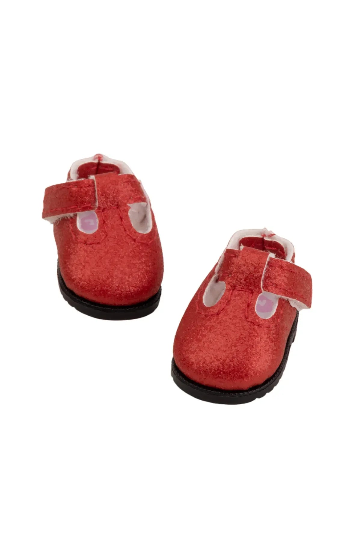 Red doll shoes with velcro straps on a white background