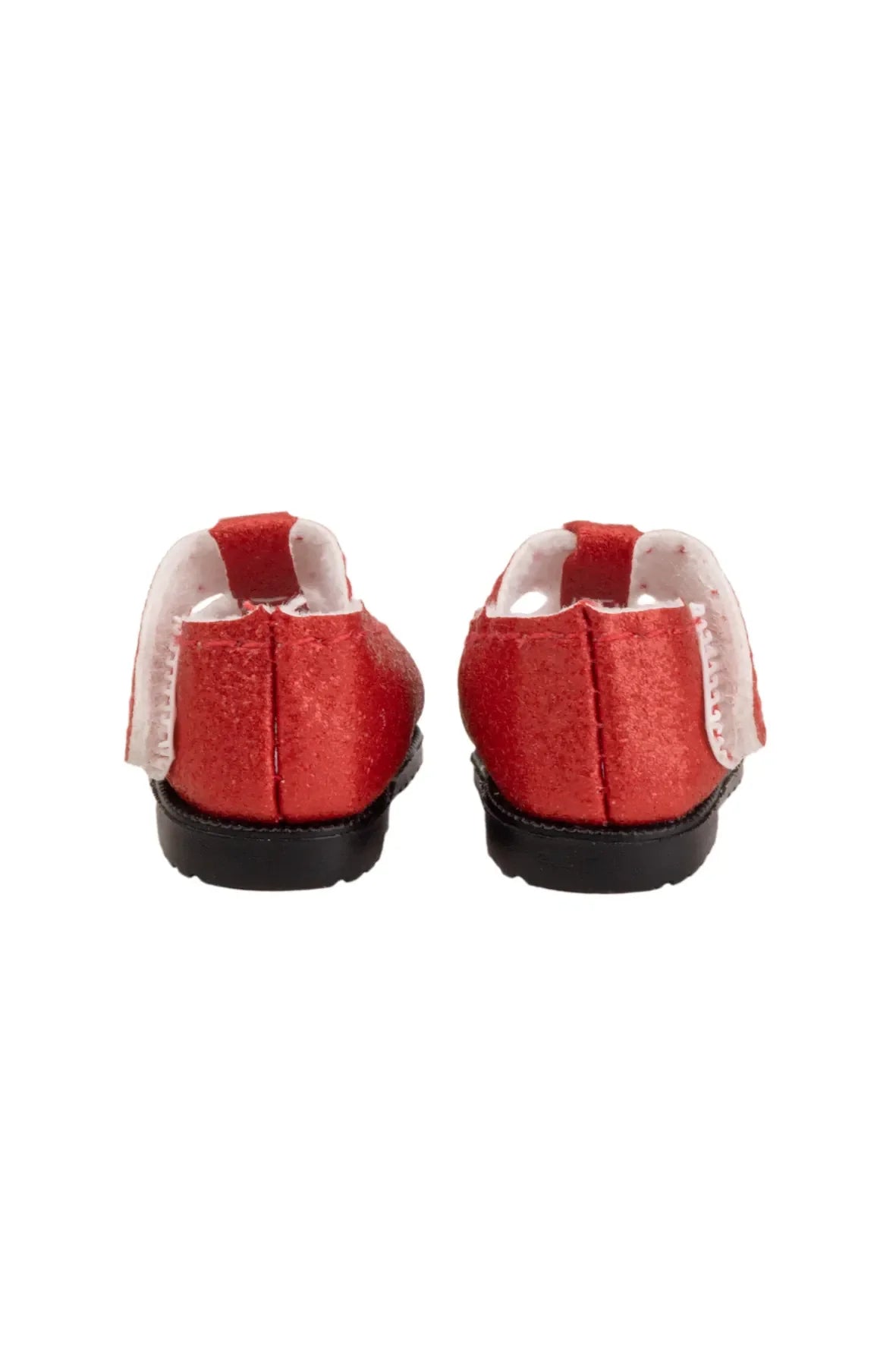 Red doll shoes back view on a white background