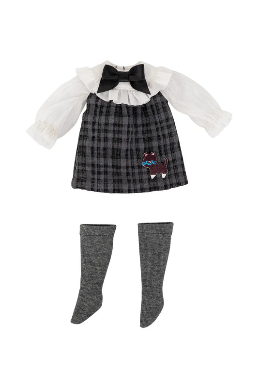 A doll outfit set featuring a black and gray plaid pinafore dress with a white ruffled long-sleeve shirt underneath, a black bow at the neckline, a small embroidered cat patch on the skirt, and matching gray knee-high socks, all displayed on a plain white background.