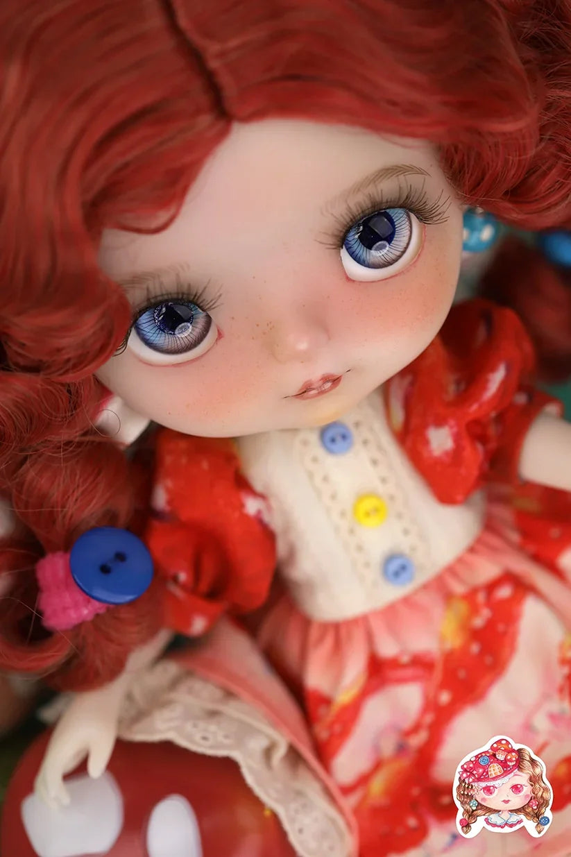 Close-up of a Mori Lolli doll with red hair and colorful outfit