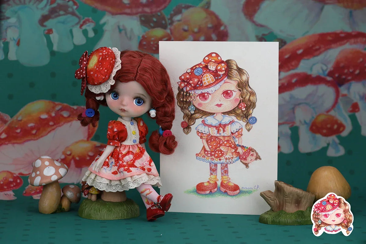 Mori Lolli Doll with red hair and a matching outfit next to a drawing of the same character.
