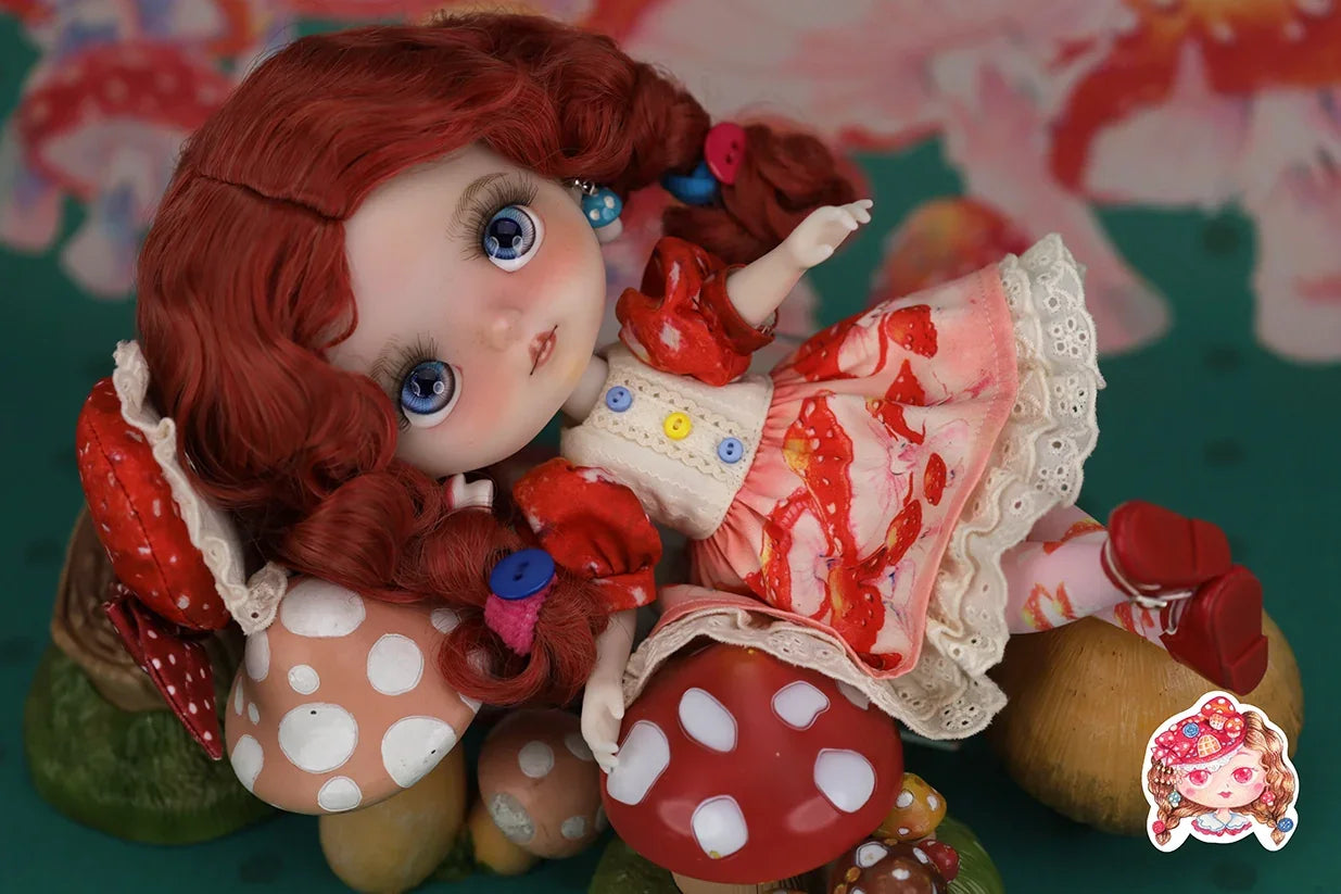 Mori Lolli doll with red hair and colorful dress on a mushroom-themed background