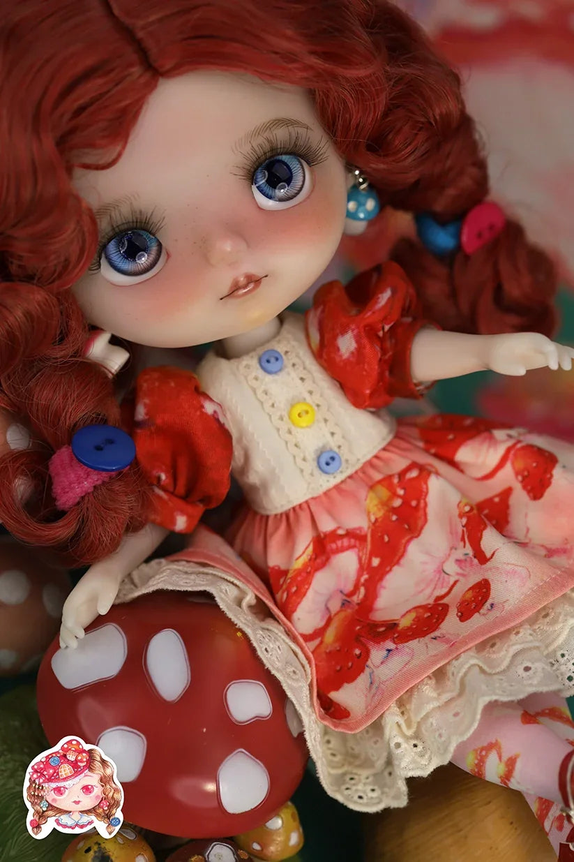 Mori_Lolli_Mushroom_Fantasia Doll with red hair and colorful outfit on a blurred background