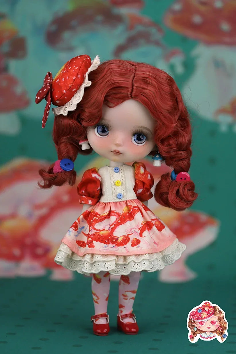 Mori Lolli Doll with red hair and a mushroom-themed outfit against a colorful background