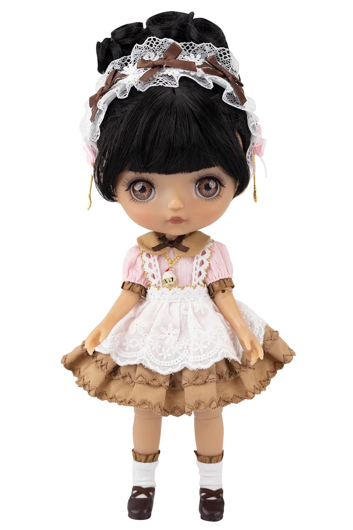 Doll with black hair, lace headband, and vintage-style outfit on a white background