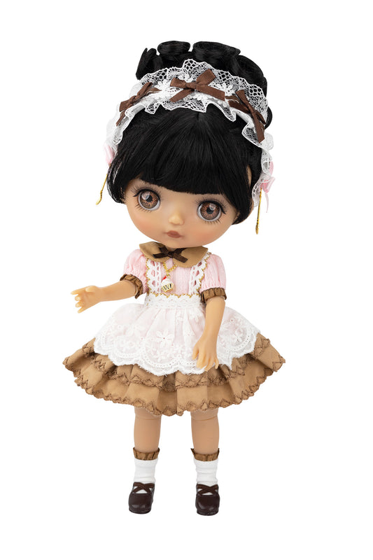 Doll with black hair, lace headband, pink dress, and brown skirt on a white background