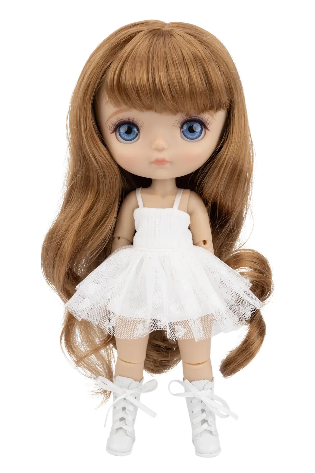 A doll with long auburn-brown hair, blue eyes, and a white sleeveless tutu dress with white lace-up shoes, shown against a plain white background.