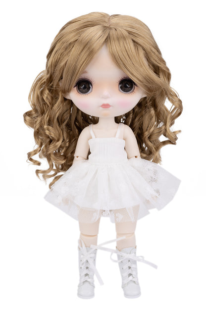 Doll with long blonde hair wearing a white dress on a white background