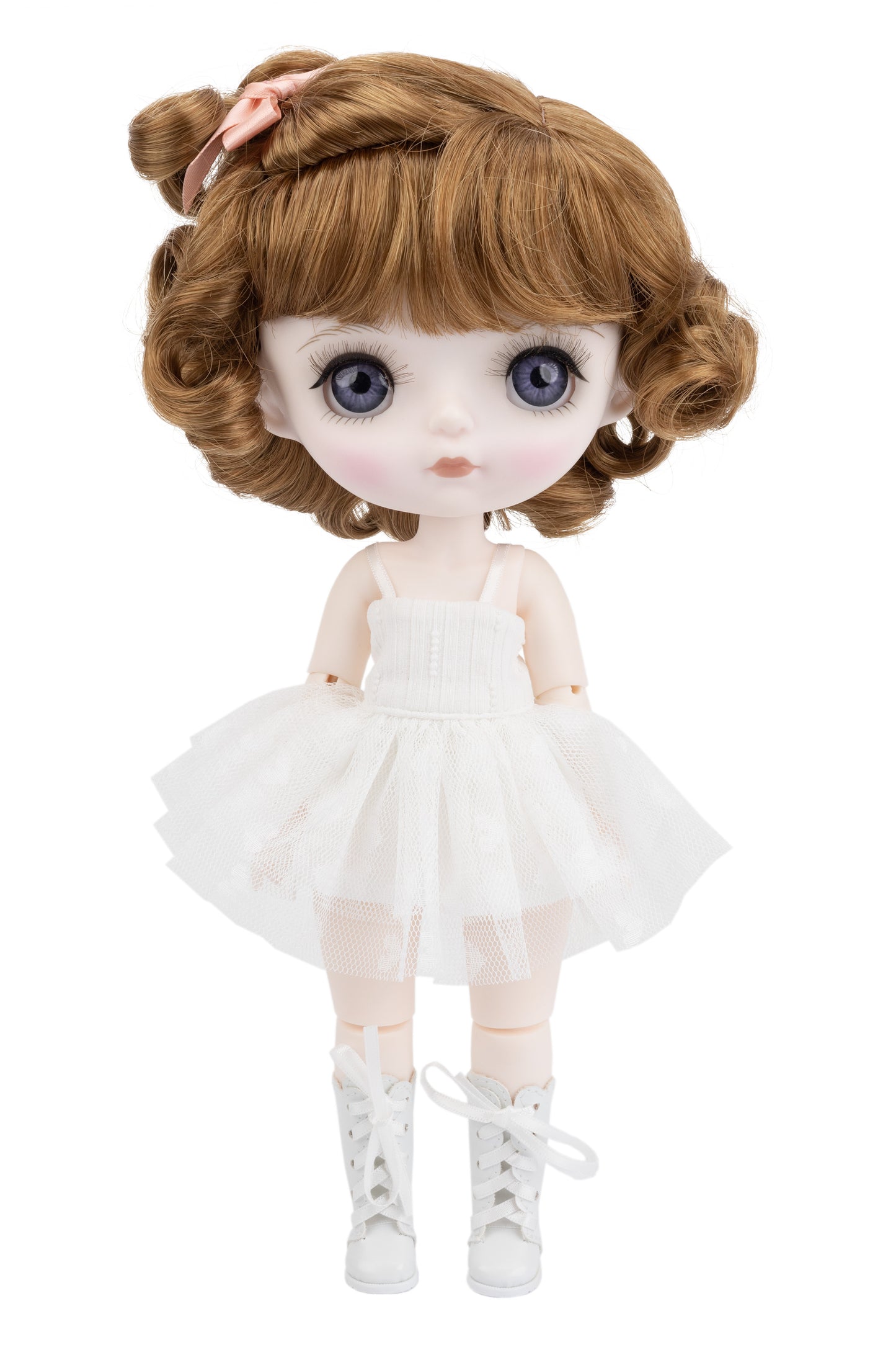 Doll with auburn hair and a white dress on a white background
