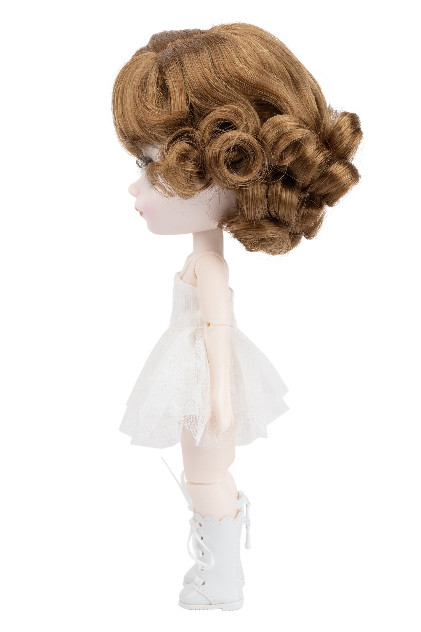 Doll with a styled wig and white outfit on a white background