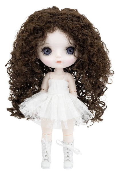 A doll with large blue eyes, long curly brown hair, and a white tutu dress with white lace-up boots, shown against a plain white background.