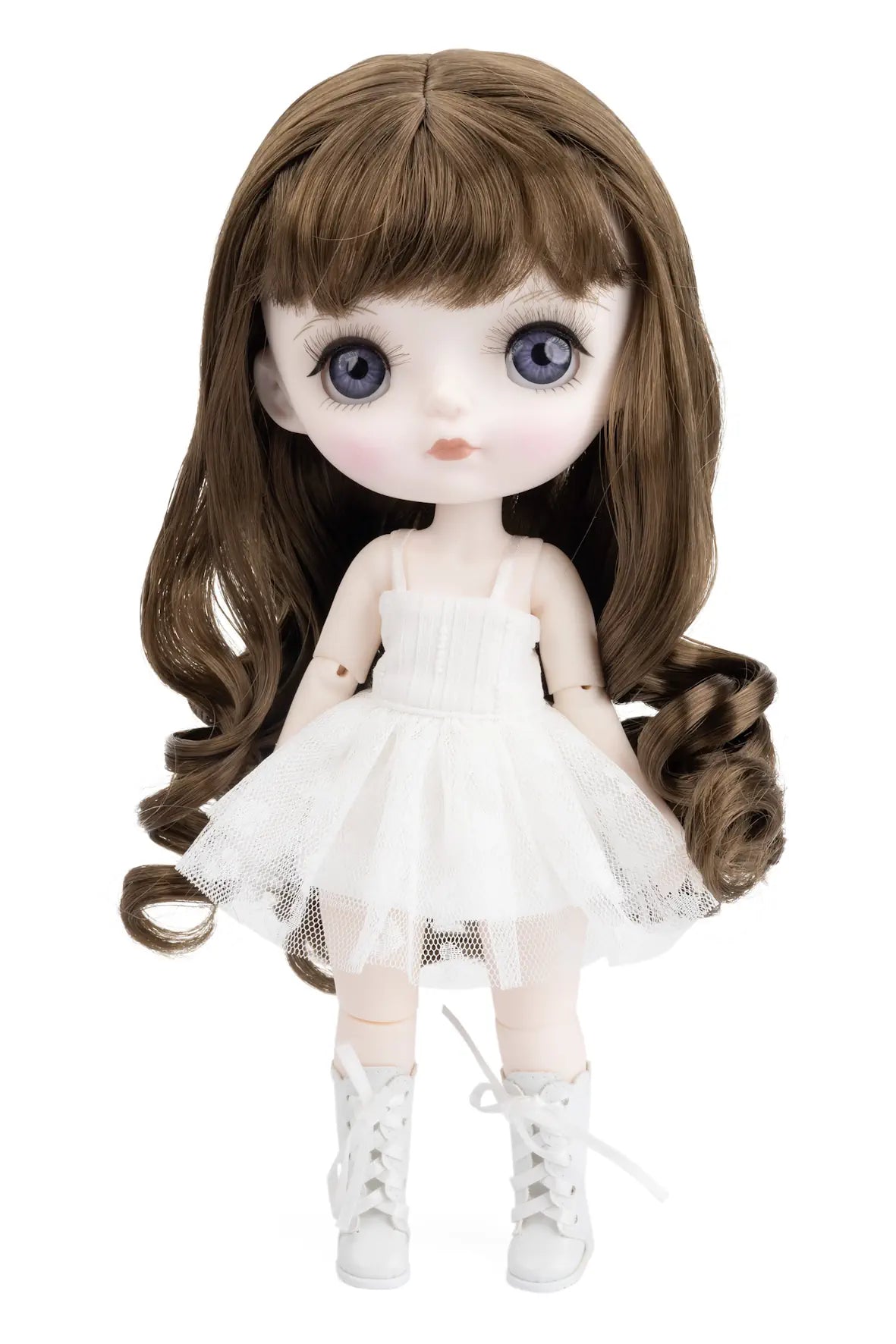 Doll with long Brunette hair and white dress on a white background