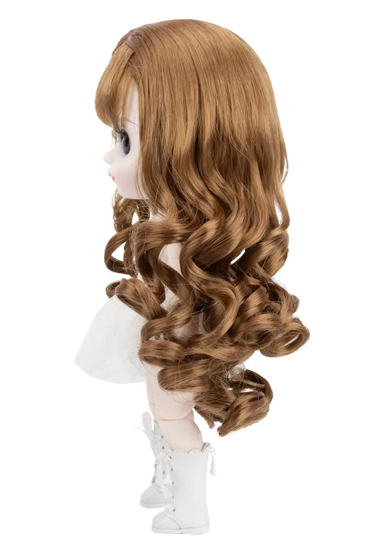 Doll with long brown hair on a white background