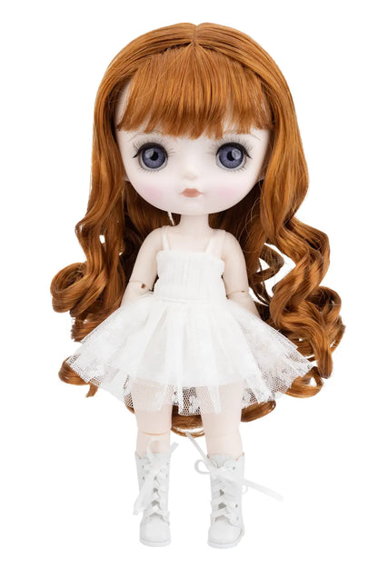 Doll with long ginger hair and a white dress on a white background