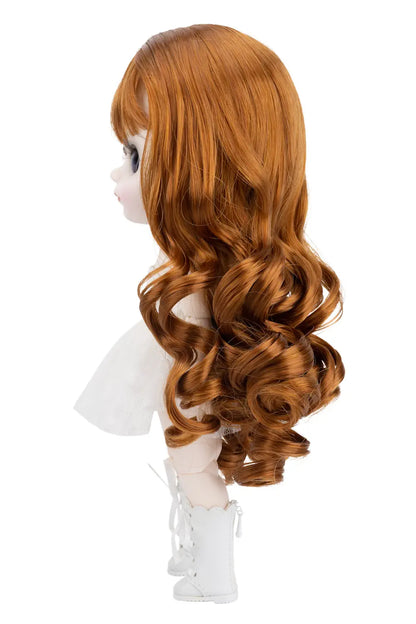 Doll with long curly ginger hair on a white background