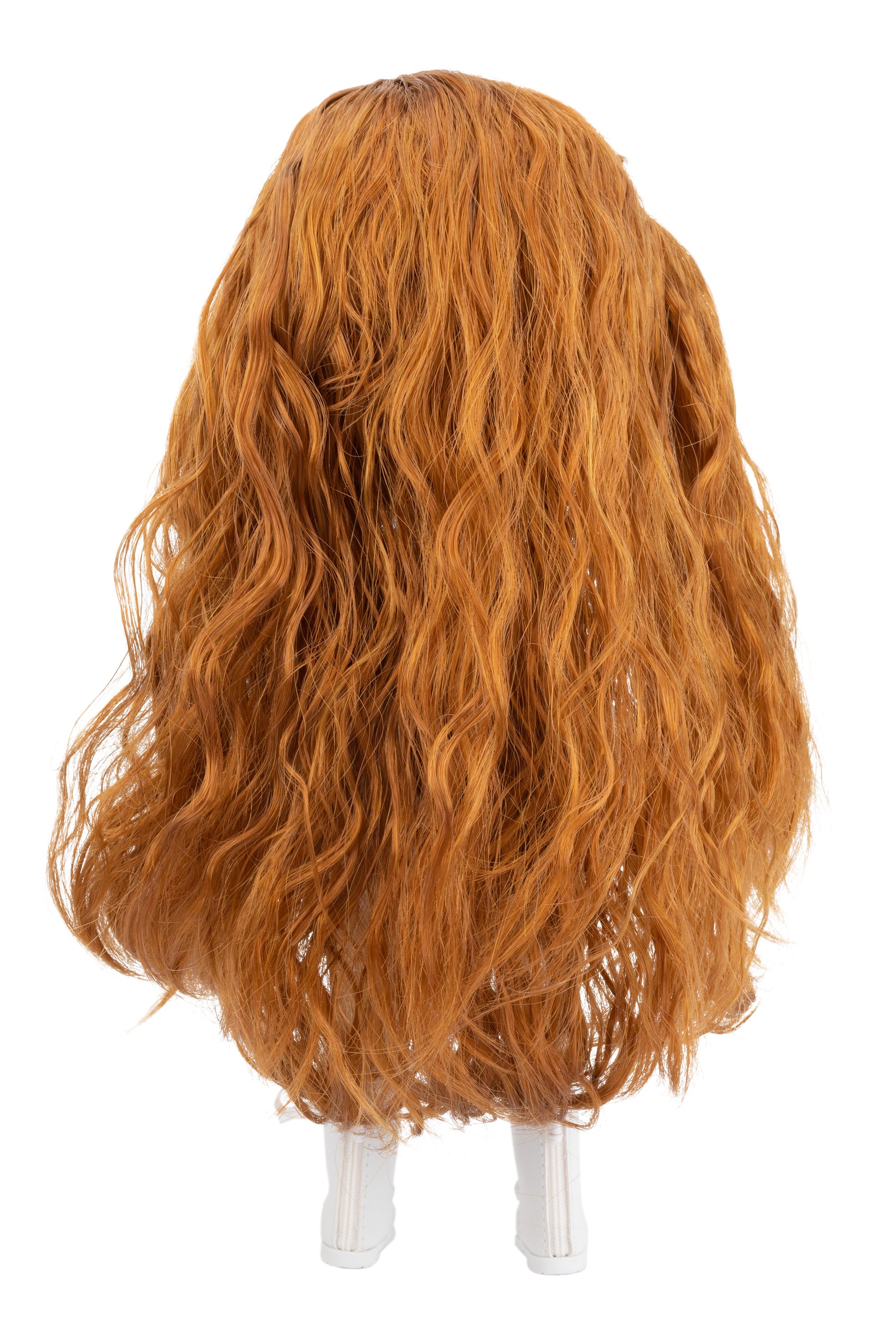 Brown wig on a doll head with a white background