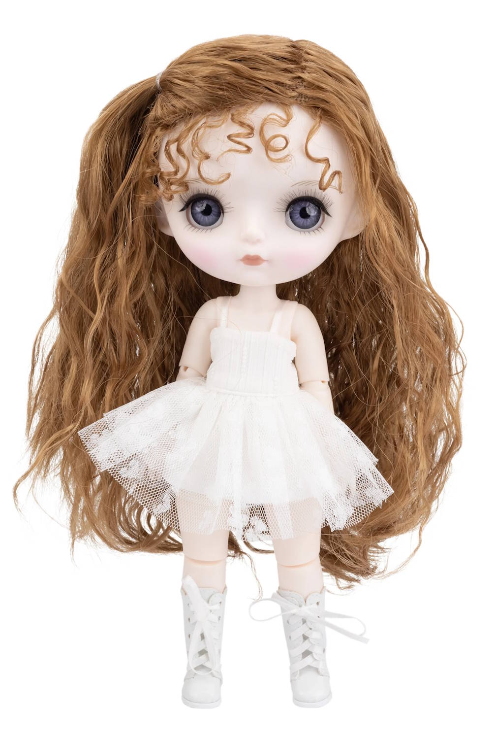 Doll with long brown hair and a white dress on a white background