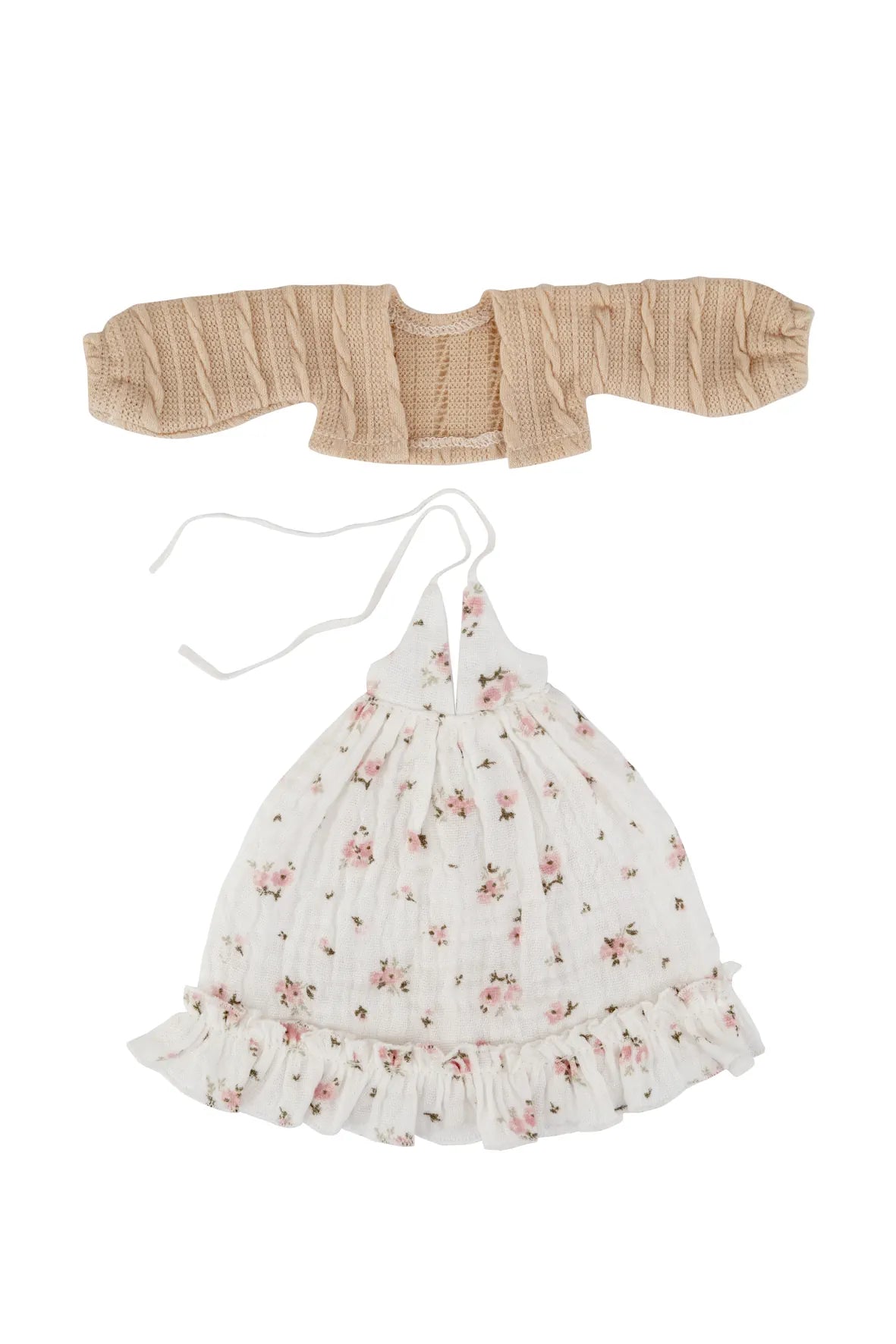 A two-piece baby outfit set on a white background, featuring a beige smocked cardigan and a white floral halter dress with a ruffled hem and tie strings.