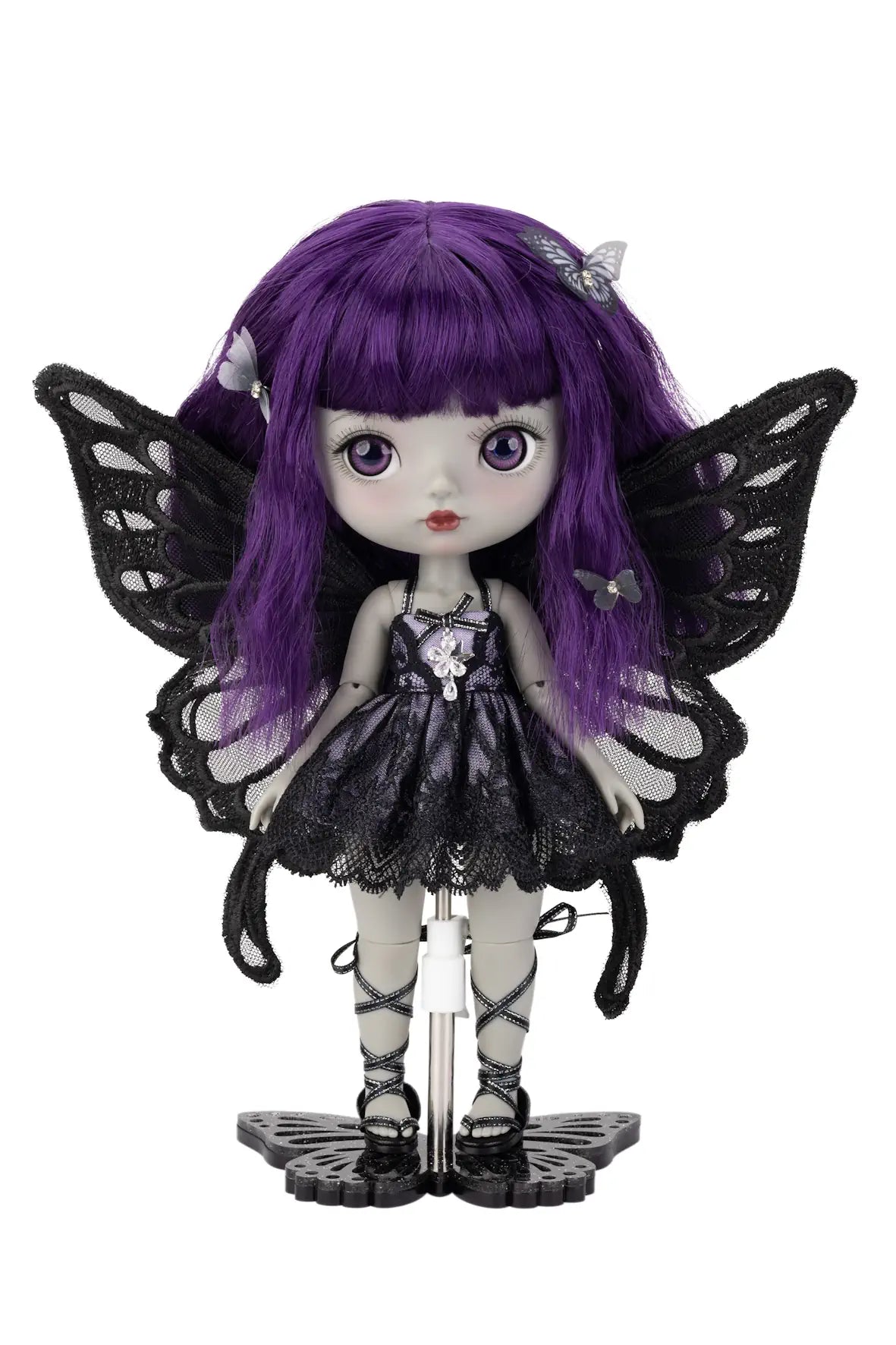 Gothic-style doll with purple hair and black butterfly wings on a white background