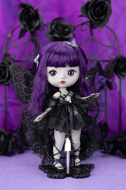 Gothic-style doll with purple hair and black outfit against a purple background with black roses.