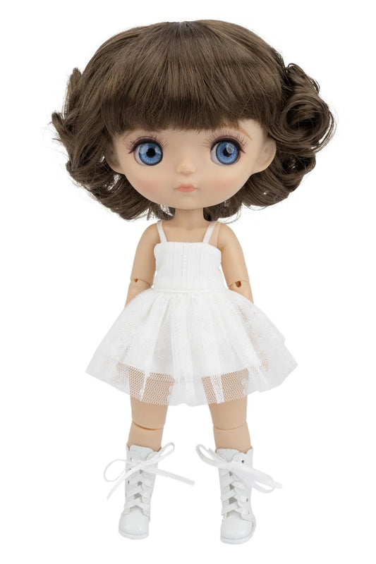 Doll with brown hair, blue eyes, and a white dress on a white background