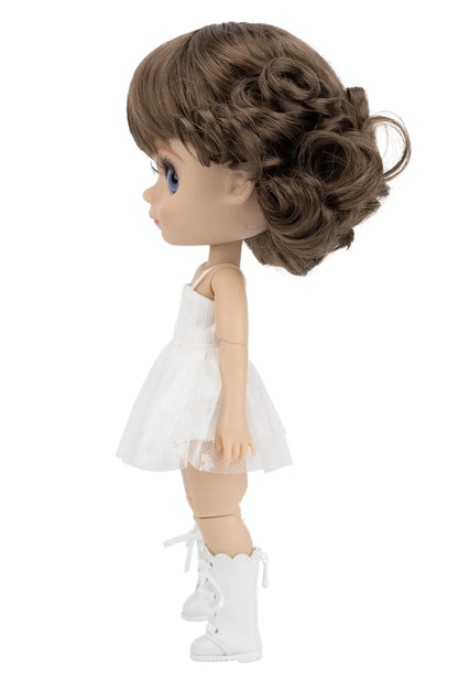 Doll with brown hair styled in an updo, wearing a white dress and white shoes on a white background