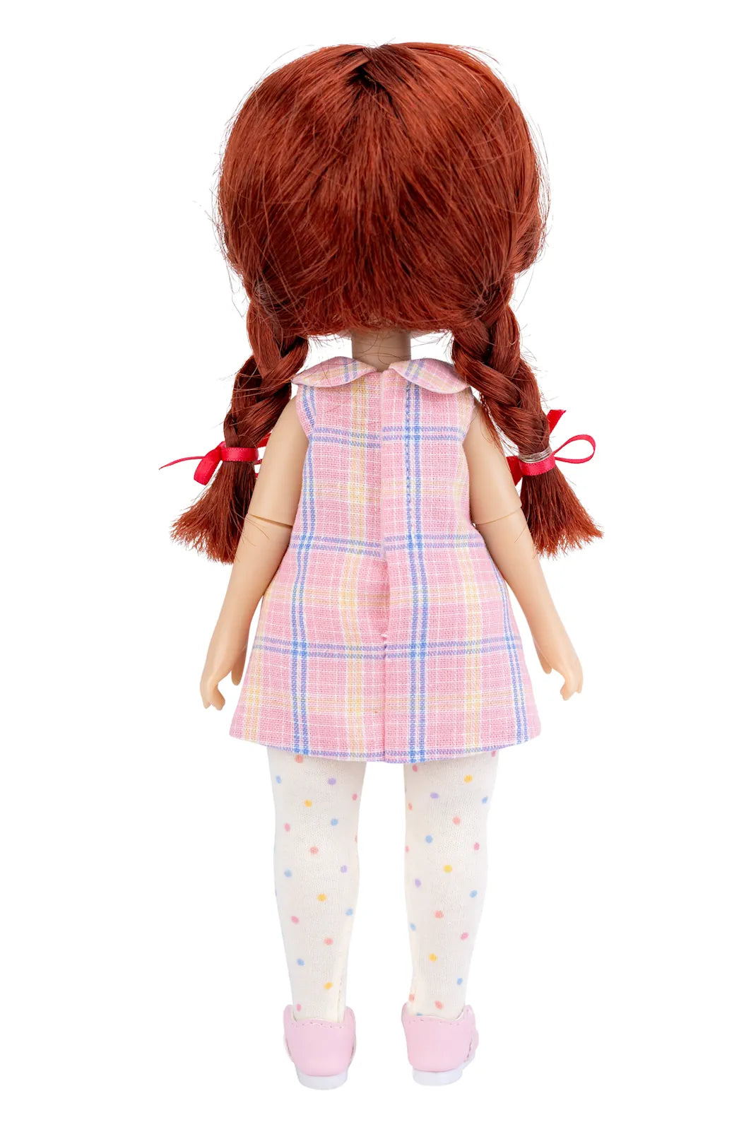 Doll with red hair in pigtails wearing a pink plaid dress on a white background