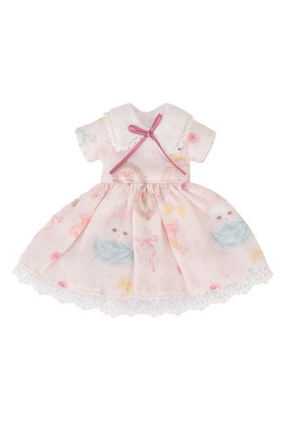 Pink dress with bunny pattern on a white background