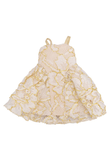 A sleeveless doll dress in white lace with gold trim and gold spaghetti straps, shown against a plain white background.