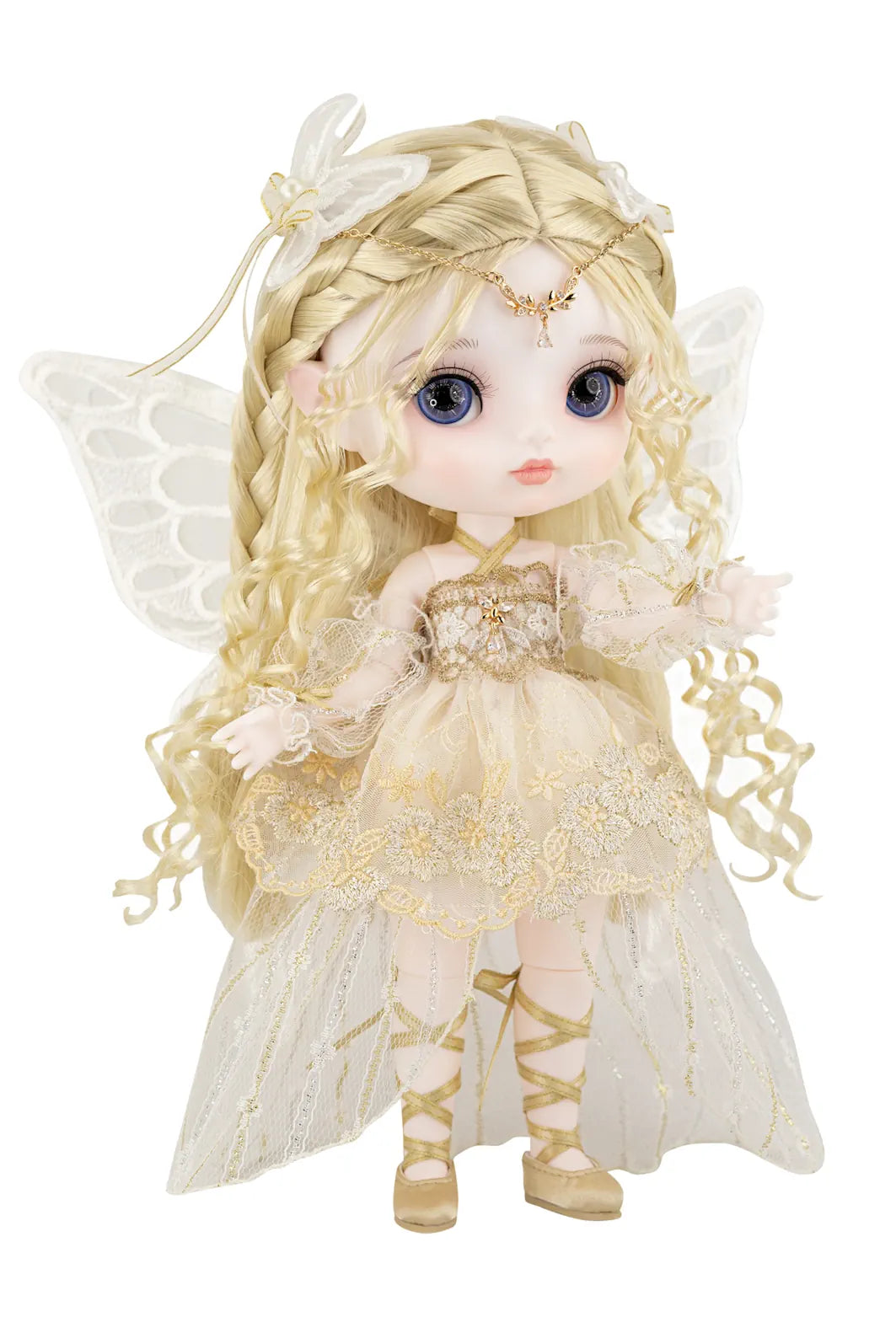 Doll with fairy-like appearance wearing a detailed dress and wings on a white background