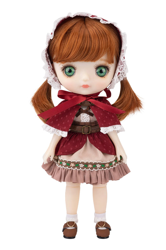 Doll with ginger hair and traditional outfit on a white background