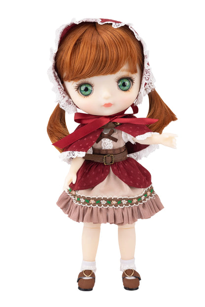 Doll with ginger hair and traditional outfit on a white background