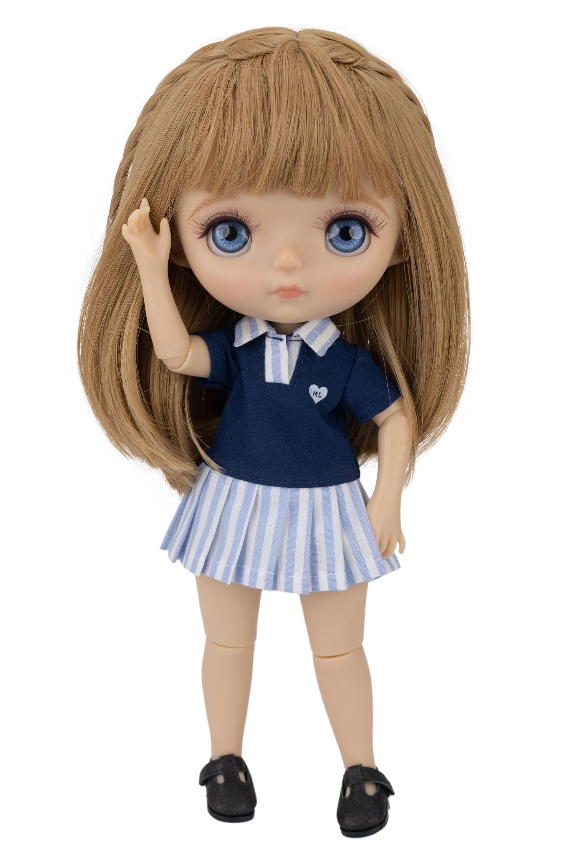 Doll wearing a navy blue top paired with a playful striped skirt.