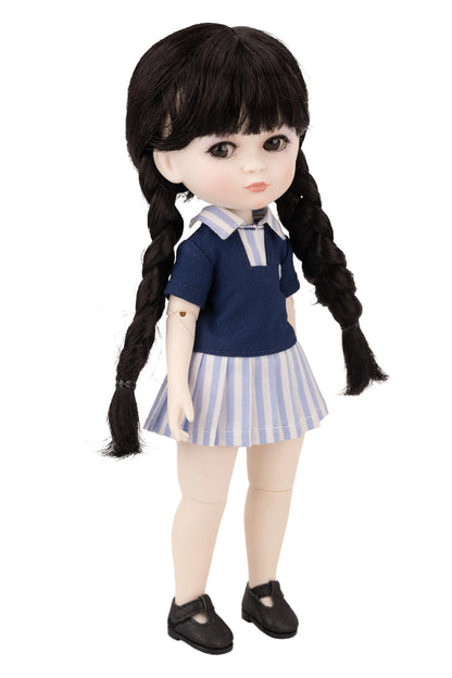 Doll with black hair styled in pigtails, wearing a blue top and striped skirt on a white background.