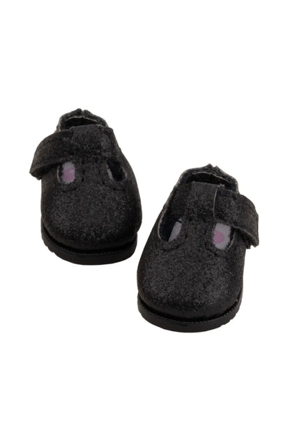 Pair of black doll shoes with velcro straps on a white background