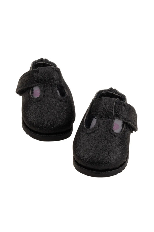 Pair of black doll shoes with velcro straps on a white background
