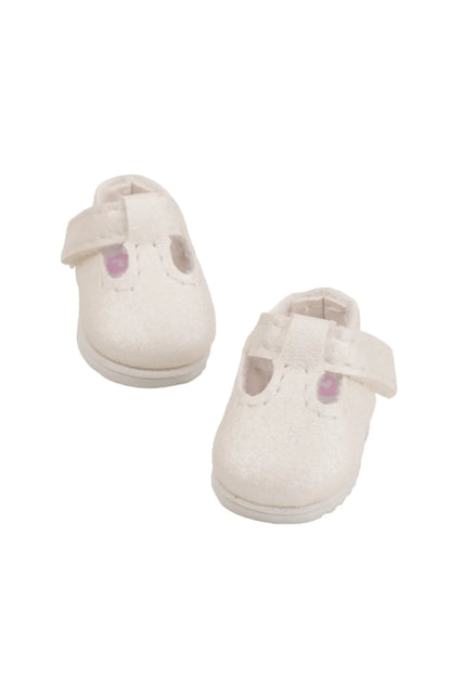 Pair of white doll shoes on a white background