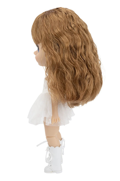 Doll with long blonde hair, white dress, and white shoes on a white background
