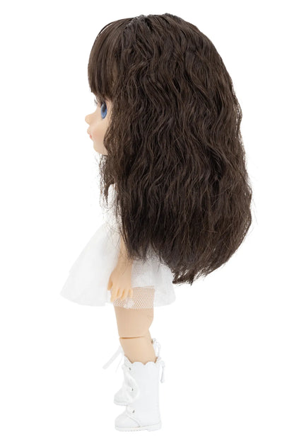 Doll with long dark brown hair on a white background