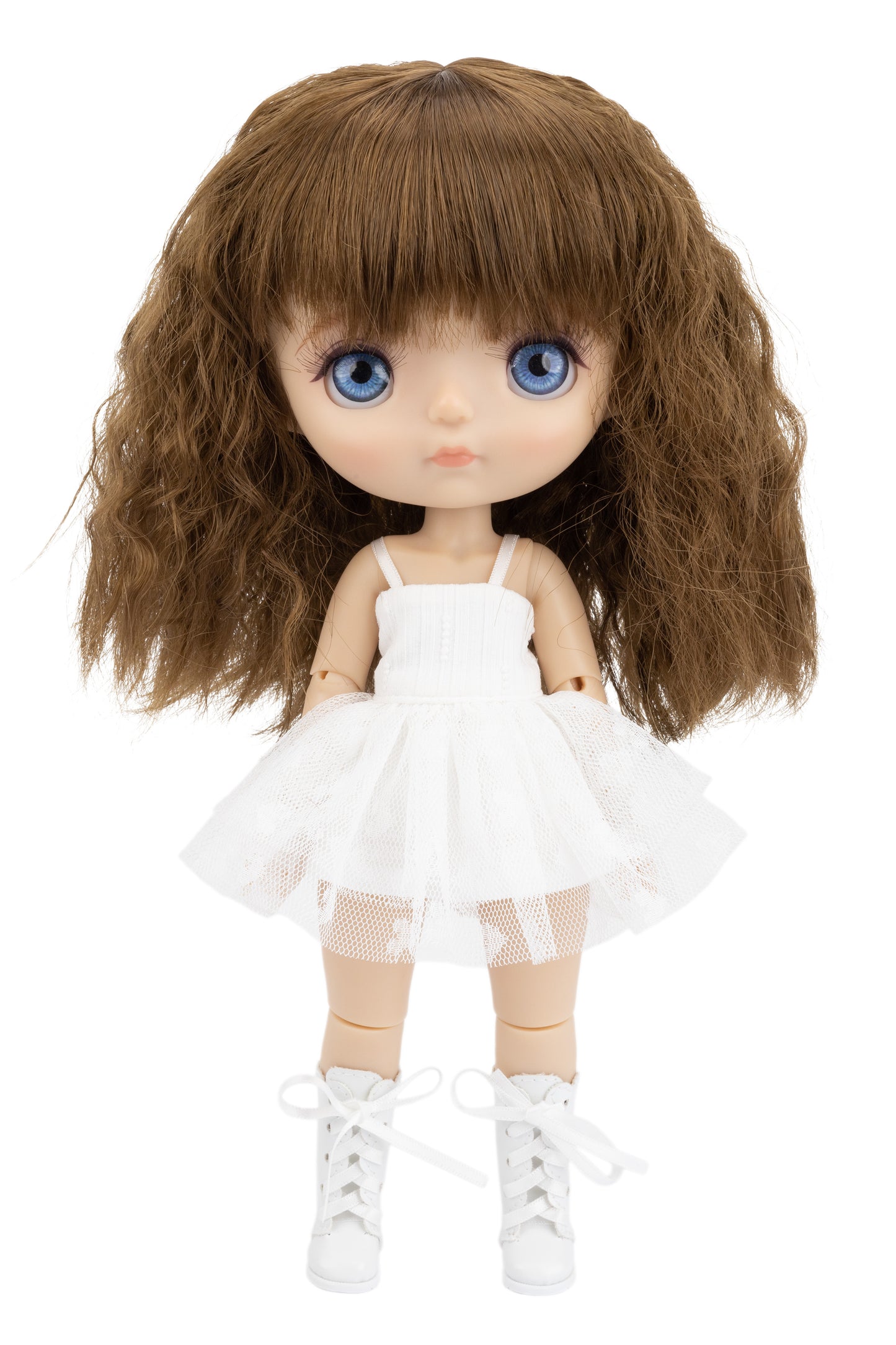 Doll with long brown hair, blue eyes, and a white dress on a white background