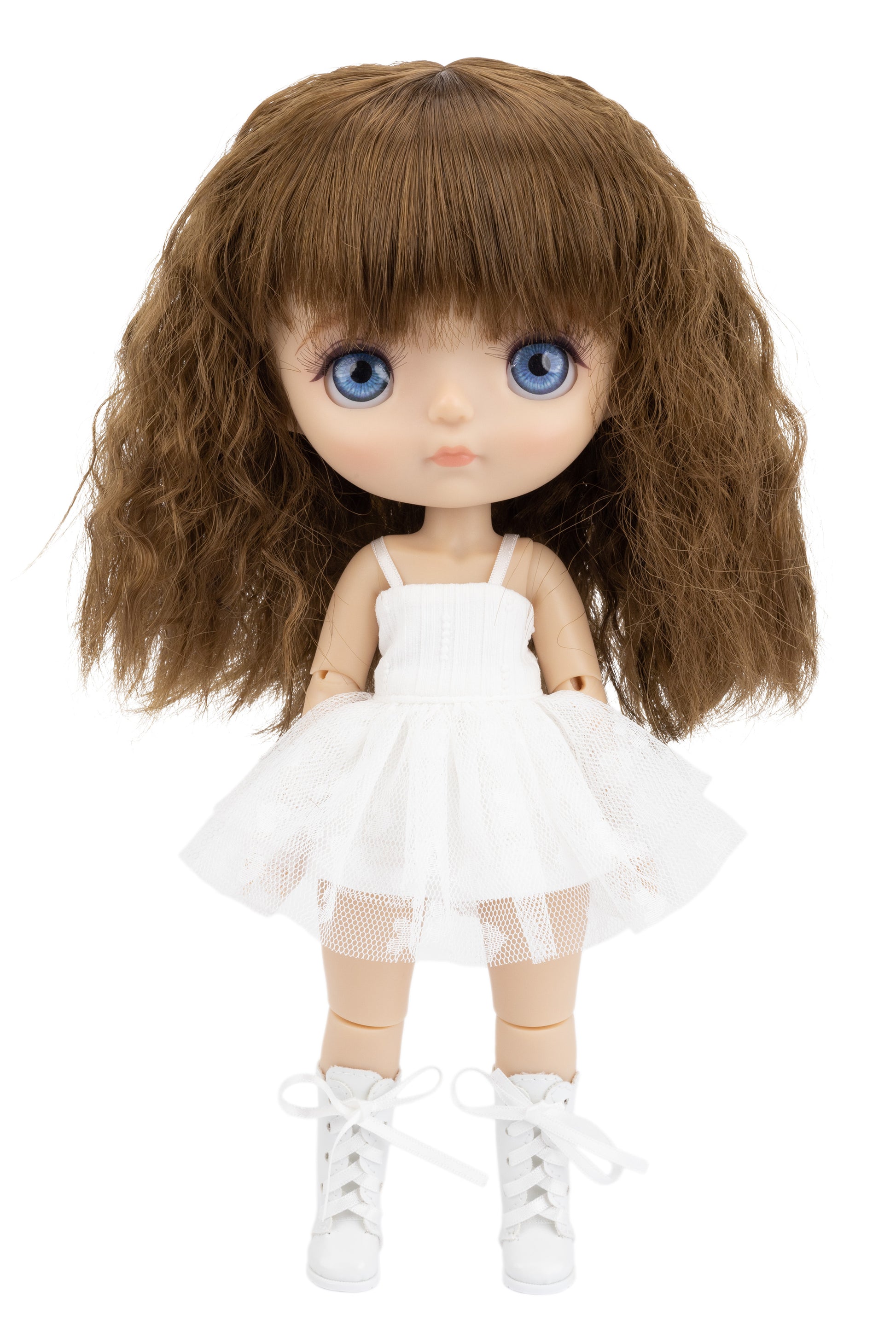 Doll with long brown hair, blue eyes, and a white dress on a white background